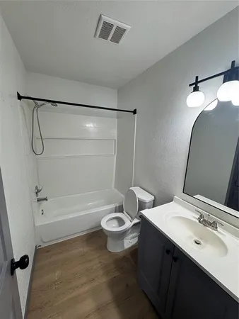a view of hallway with wooden floor