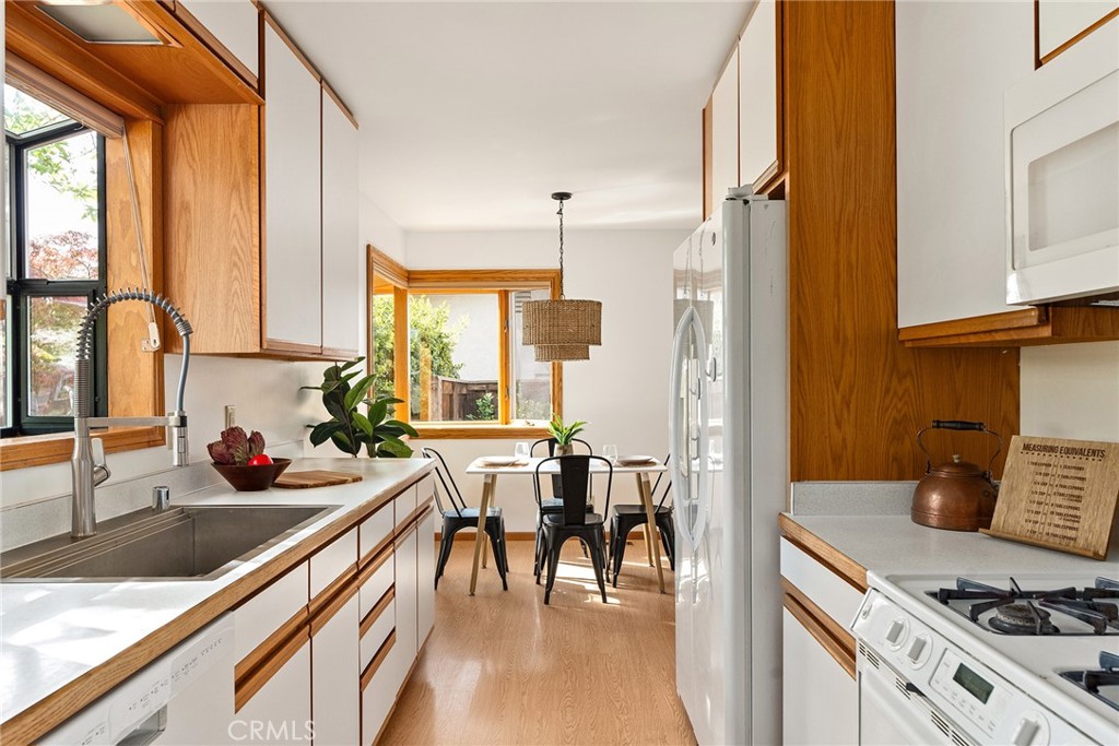 12 Amber Way Chico, CA 95926 - Photo 18 of 37 a kitchen with stainless steel appliances a stove a sink and a refrigerator