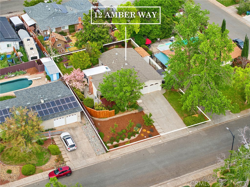 12 Amber Way Chico, CA 95926 - Photo 3 of 37 an aerial view of a tennis ground with large trees