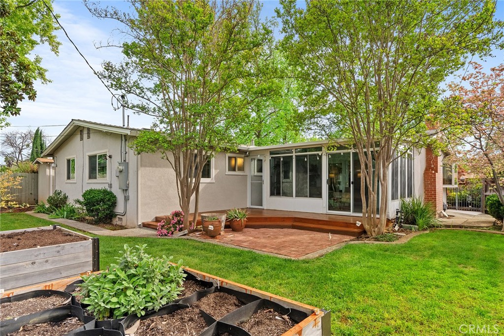 12 Amber Way Chico, CA 95926 - Photo 31 of 37 a view of a backyard with table and chairs and a large tree