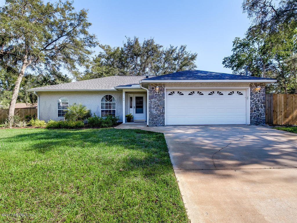 144 Tanager Road St. Augustine, FL 32086 - Photo 1 of 46 a front view of house with yard and green space