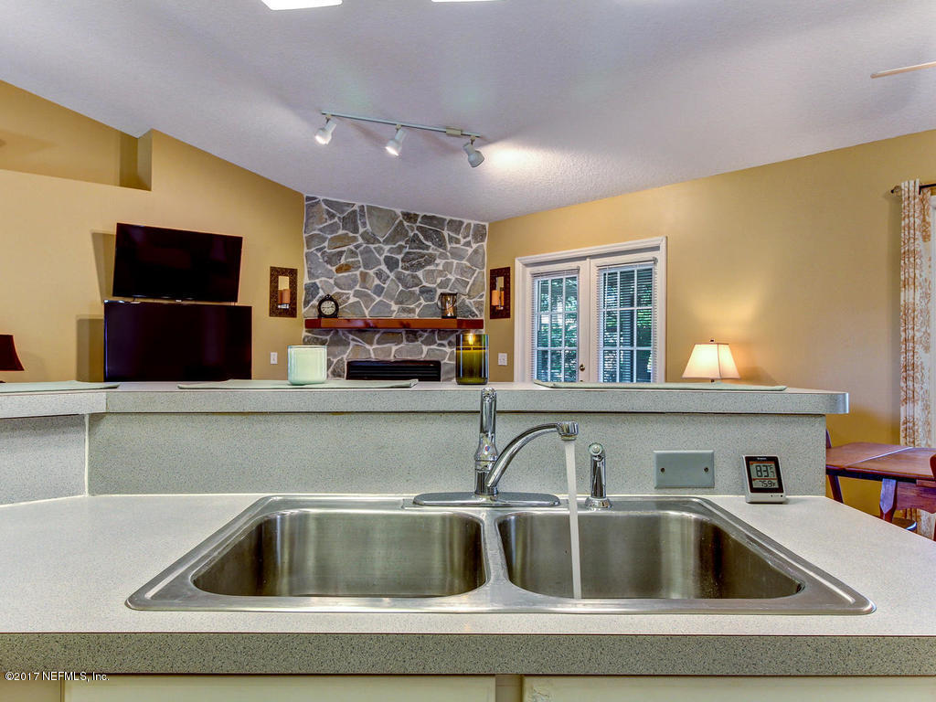 144 Tanager Road St. Augustine, FL 32086 - Photo 13 of 46 a kitchen with a sink and a microwave