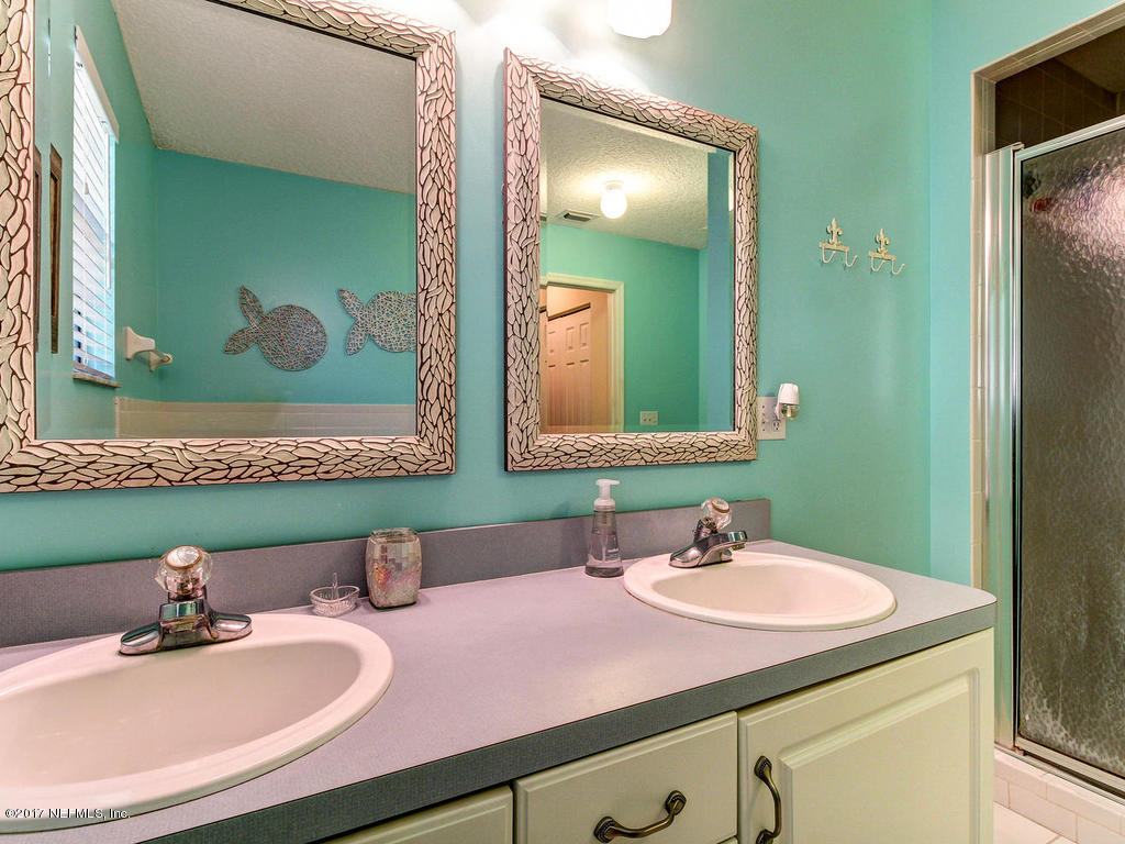 144 Tanager Road St. Augustine, FL 32086 - Photo 17 of 46 a bathroom with a sink and a mirror