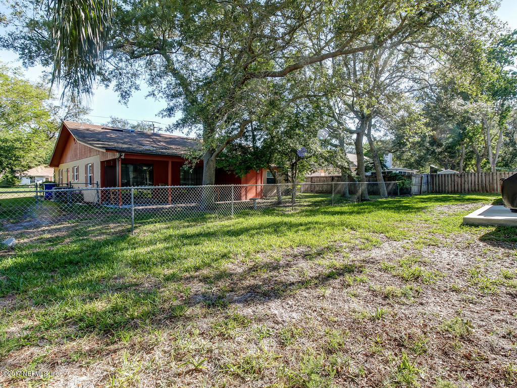 144 Tanager Road St. Augustine, FL 32086 - Photo 30 of 46 a view of a house with a yard and sitting area