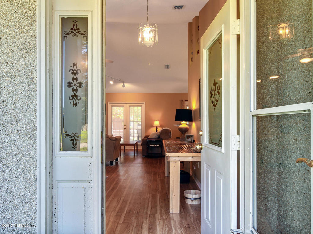 144 Tanager Road St. Augustine, FL 32086 - Photo 3 of 46 a living room with furniture and a wooden floor