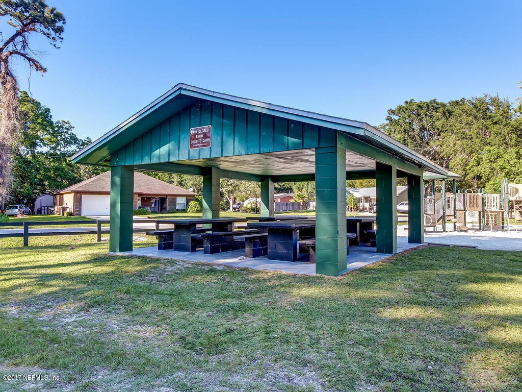 144 Tanager Road St. Augustine, FL 32086 - Photo 35 of 46 a view of a house with a yard porch and sitting area