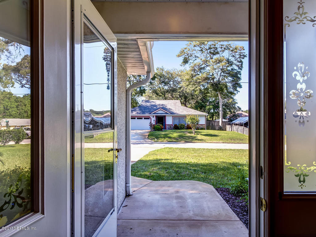 144 Tanager Road St. Augustine, FL 32086 - Photo 4 of 46 a view of a house with a porch