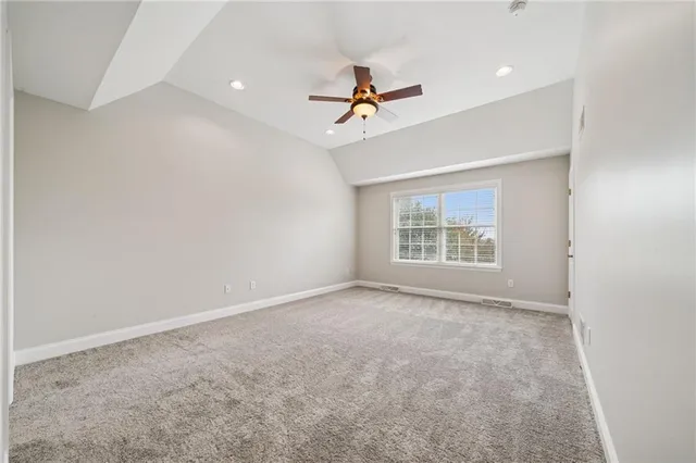 a bathroom with a granite countertop double vanity sink and a mirror