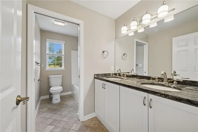 a view of an empty room and a window