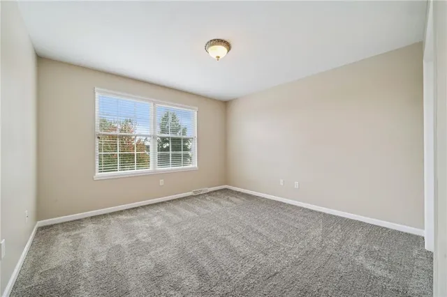 a view of hallway with wooden floor