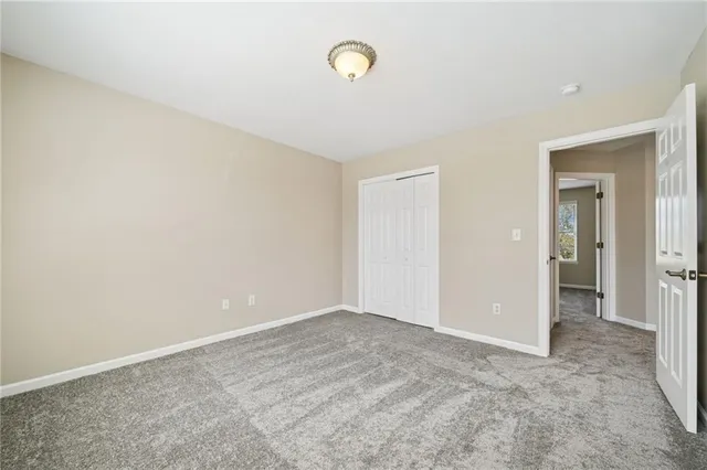 a bathroom with a toilet sink and shower