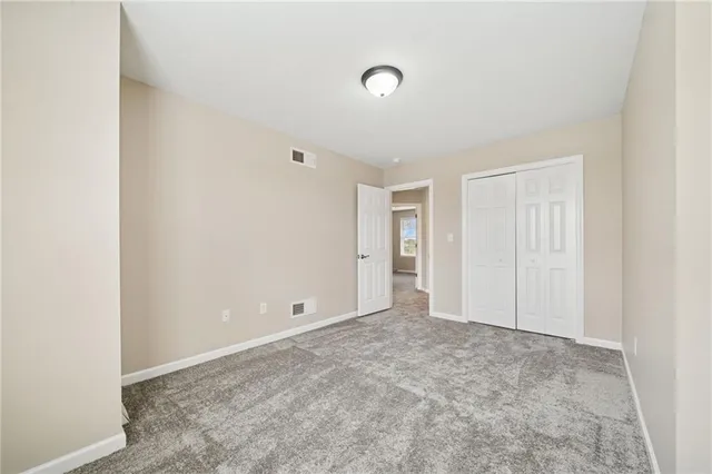 an aerial view of residential houses with outdoor space and ocean view