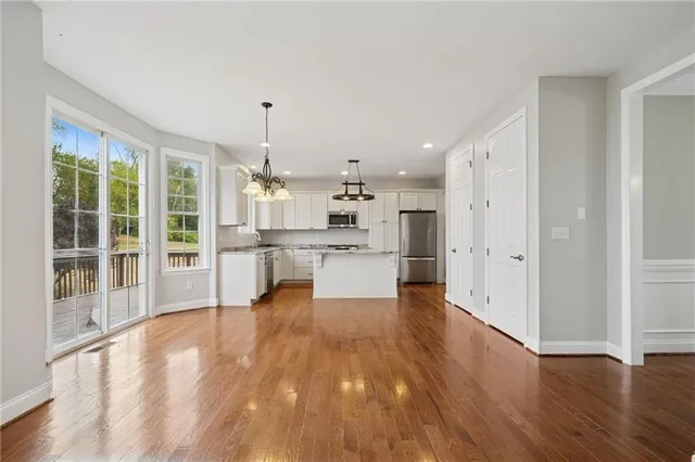 a view of a kitchen with wooden floor