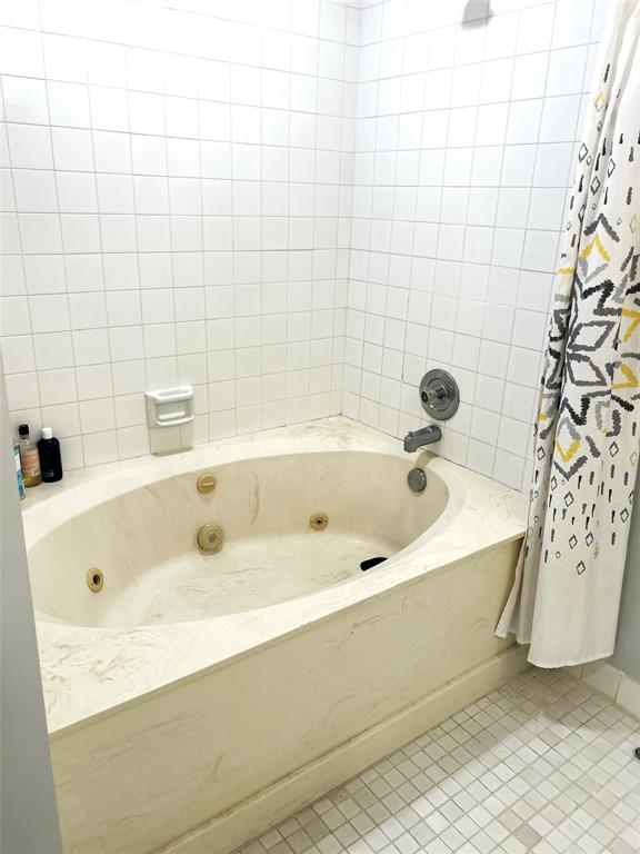 7680 Northwest 79th Avenue, Unit P1 Tamarac, FL 33321 - Photo 19 of 28 a bathroom with a tub and shower