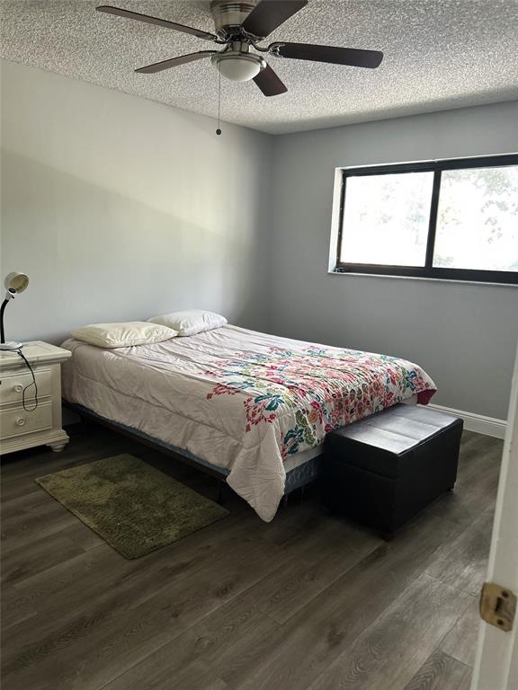 7680 Northwest 79th Avenue, Unit P1 Tamarac, FL 33321 - Photo 22 of 28 a bedroom with a bed and window