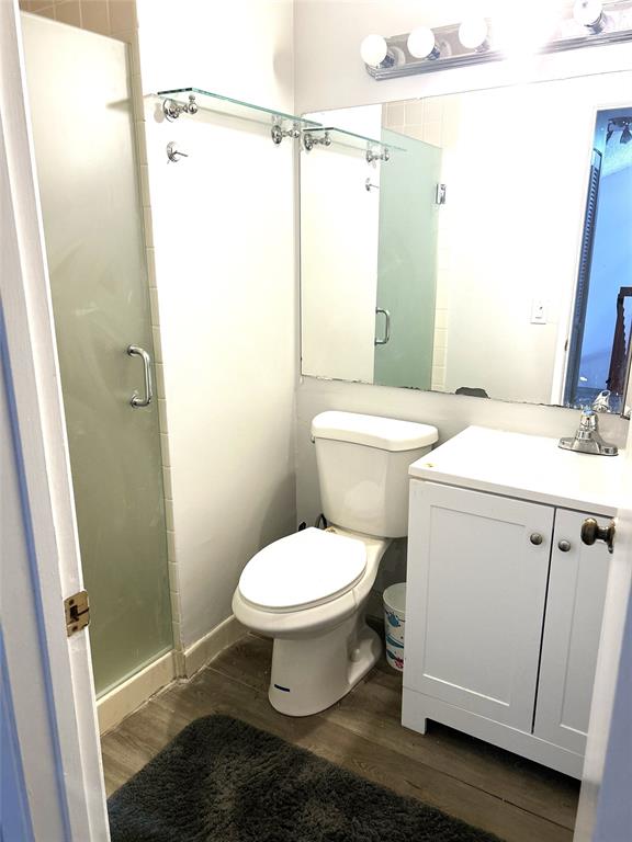 7680 Northwest 79th Avenue, Unit P1 Tamarac, FL 33321 - Photo 23 of 28 a bathroom with a toilet sink and a shower