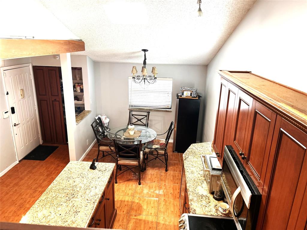 7680 Northwest 79th Avenue, Unit P1 Tamarac, FL 33321 - Photo 4 of 28 a dining room with furniture and window