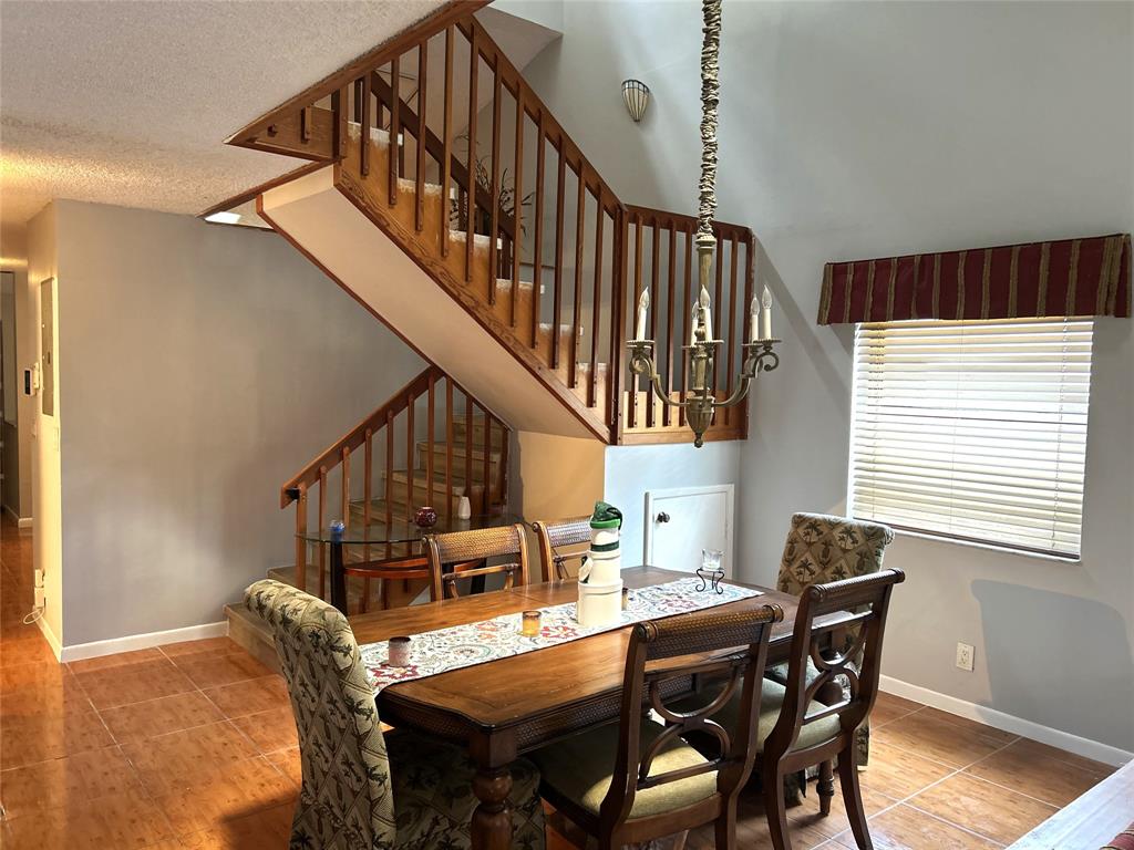 7680 Northwest 79th Avenue, Unit P1 Tamarac, FL 33321 - Photo 8 of 28 a dining room with furniture and wooden floor
