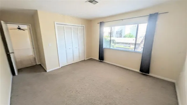 a view of a swimming pool with outdoor seating