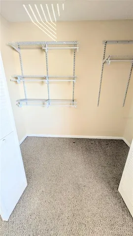 a view of a patio with couches table and chairs and potted plants