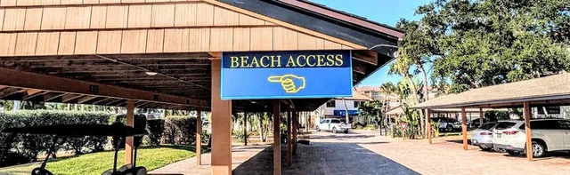 a view of a lake with a table and chairs