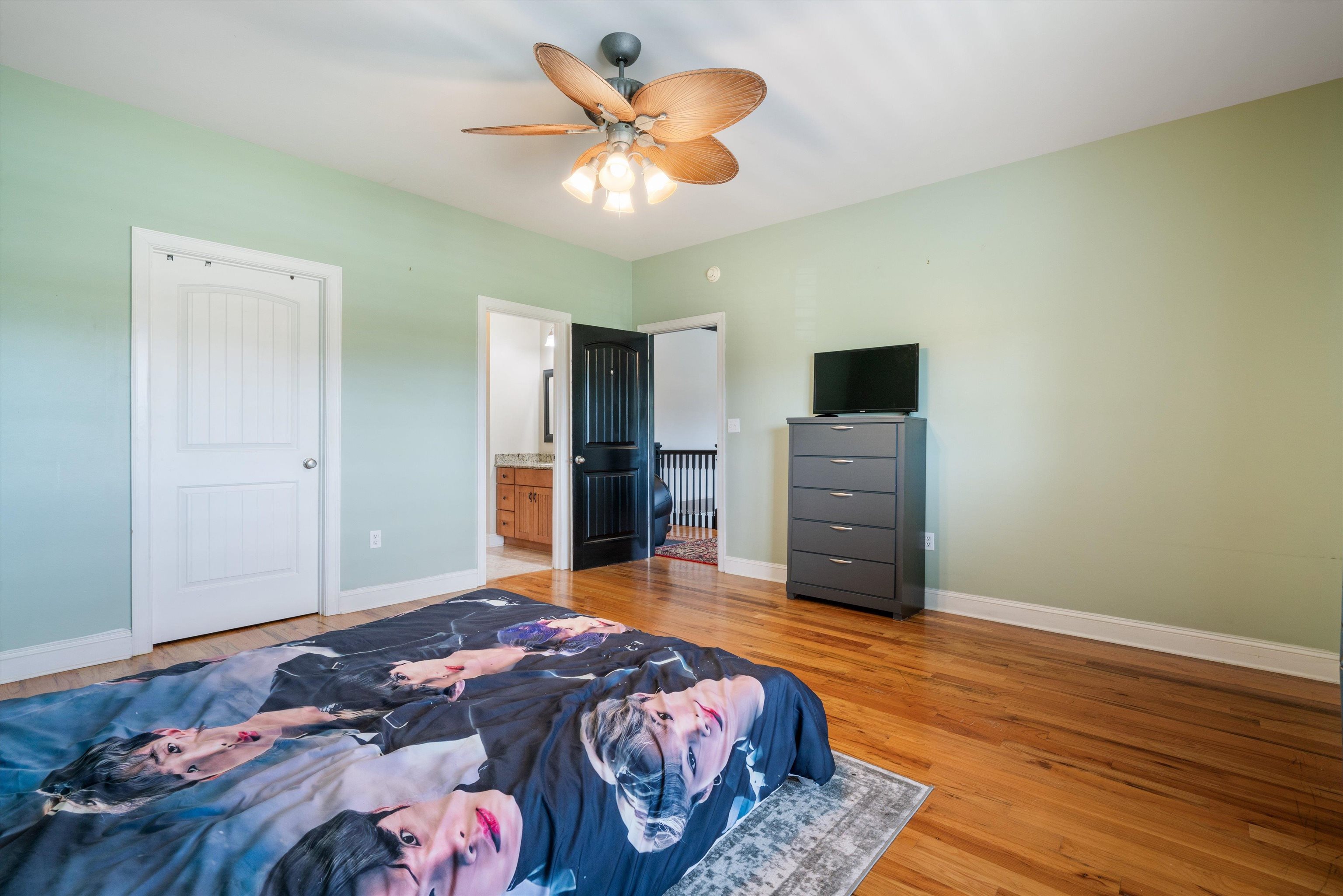 11300 Long Road Arlington, TN 38002 - Photo 20 of 39 a bedroom with a bed and a television