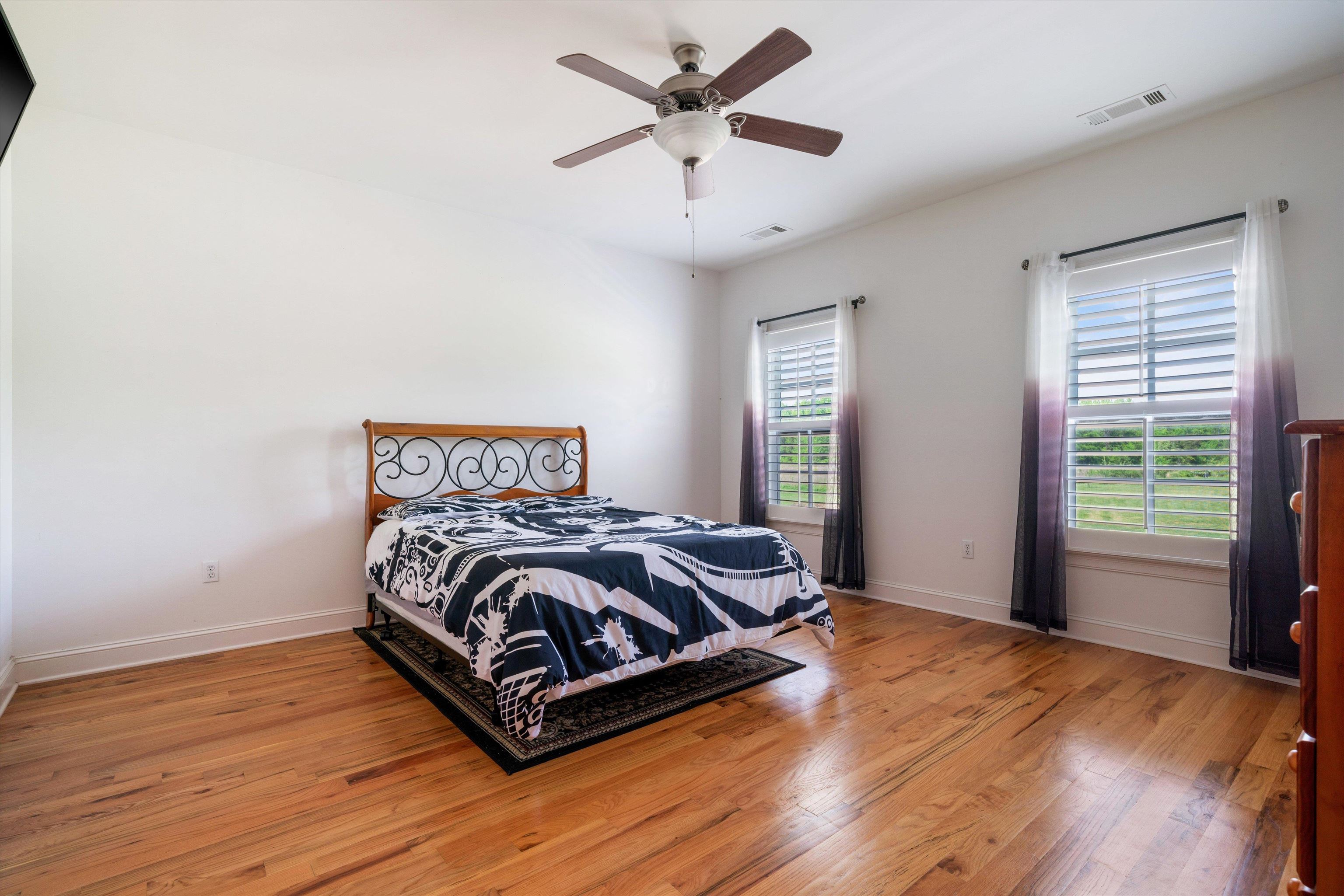 11300 Long Road Arlington, TN 38002 - Photo 23 of 39 a bed sitting in a spacious bedroom next to a window