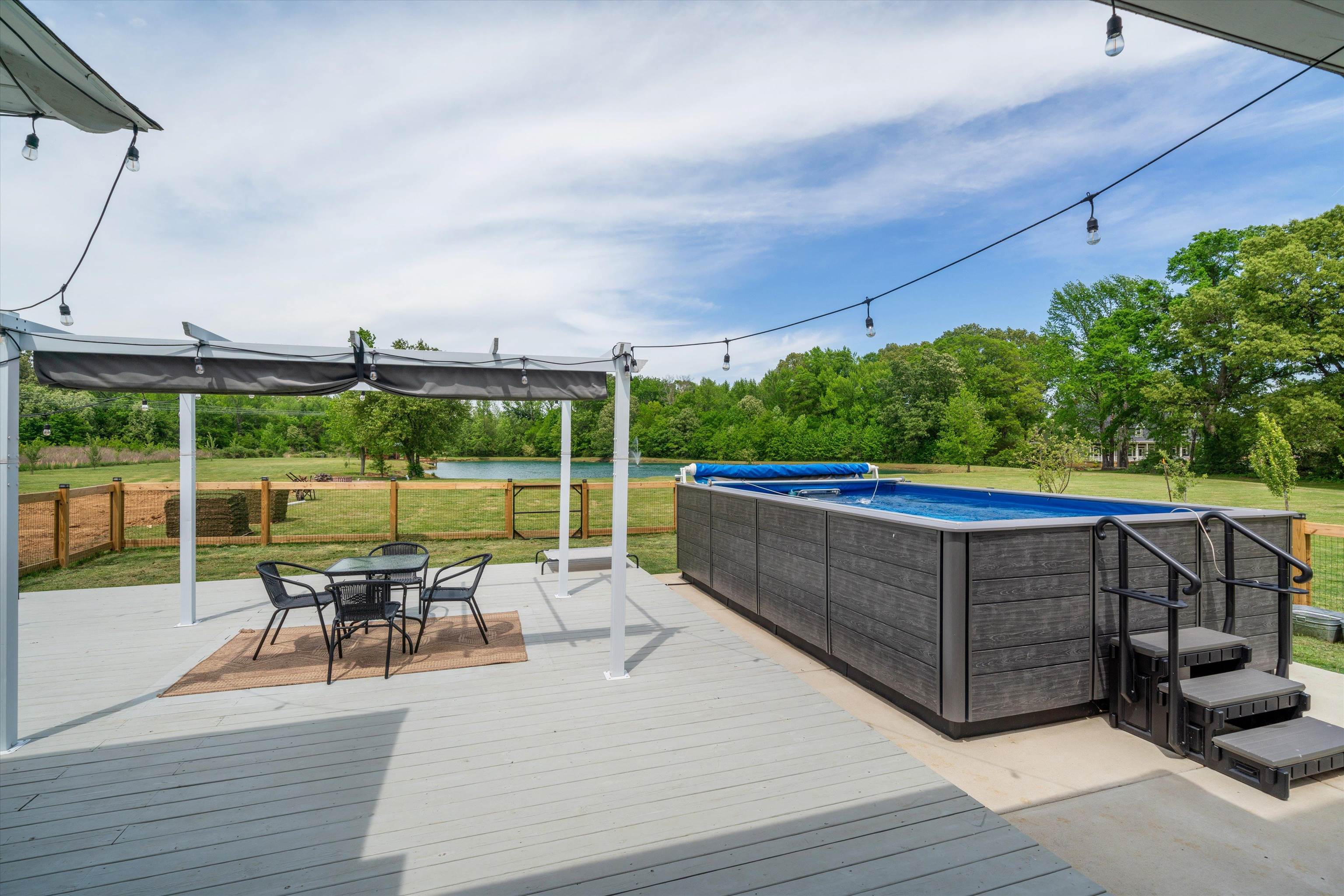 11300 Long Road Arlington, TN 38002 - Photo 35 of 39 a view of a chairs and table on the wooden deck