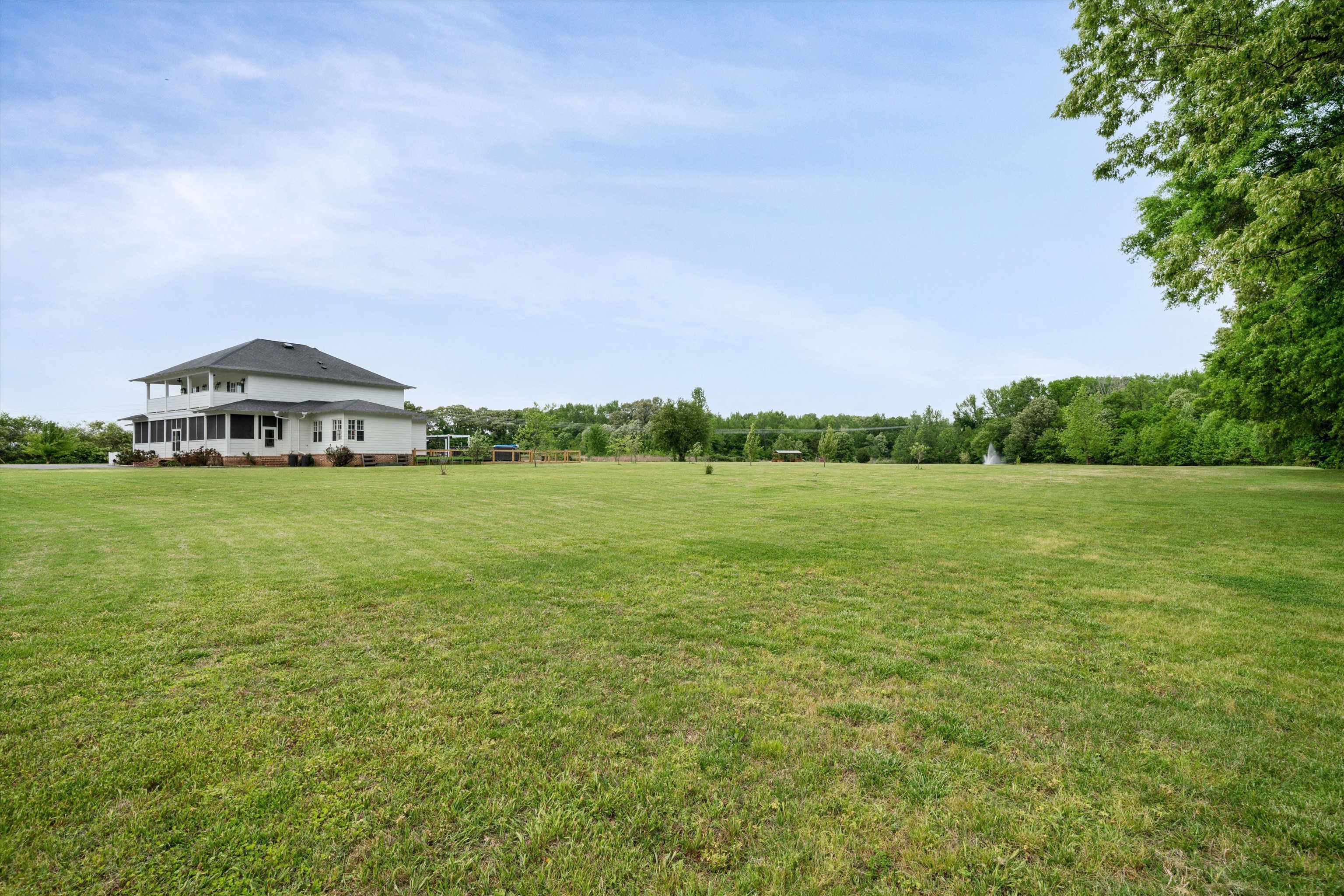 11300 Long Road Arlington, TN 38002 - Photo 39 of 39 a view of a lake with a big yard and large trees