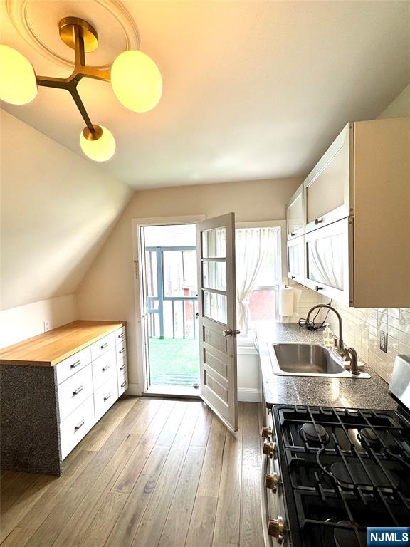 21 Valley Place, Unit 3 Edgewater, NJ 07020 - Photo 4 of 18 a kitchen with a sink appliances and cabinets