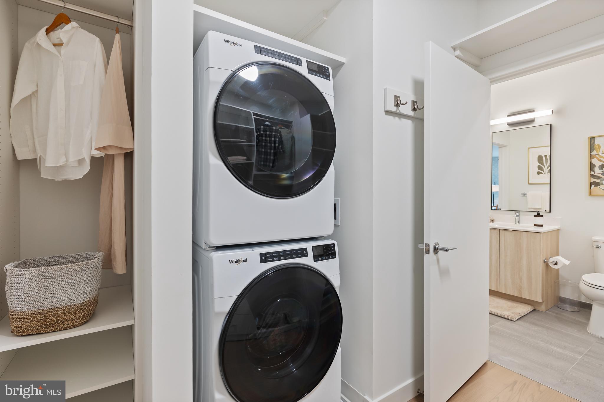 7175 12th Street Northwest, Unit 411 Washington, DC 20012 - Photo 19 of 46 a view of a hallway with washer and dryer