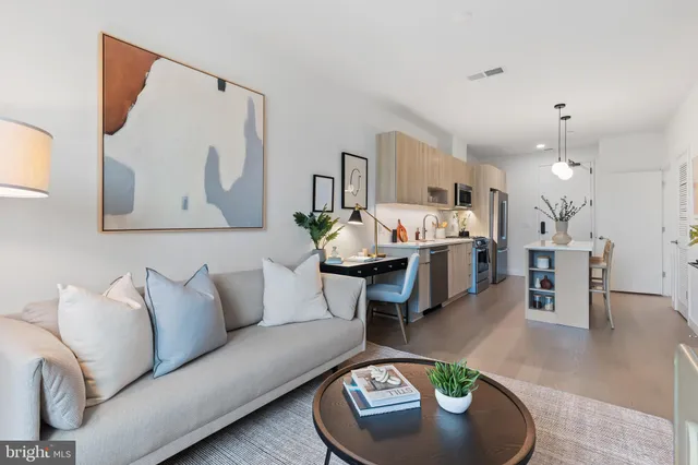 a living room with furniture and a table