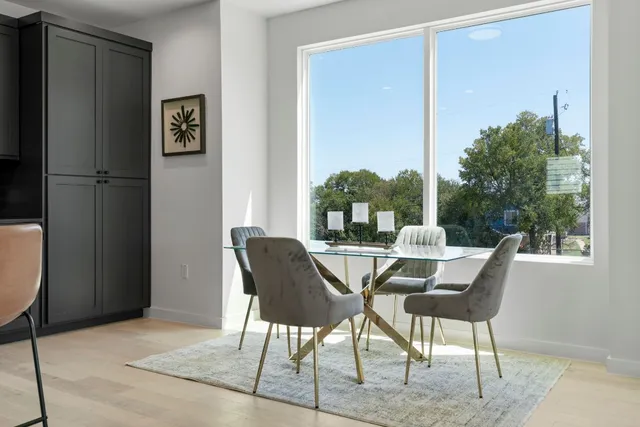 a bathroom with a sink a toilet a mirror and shower