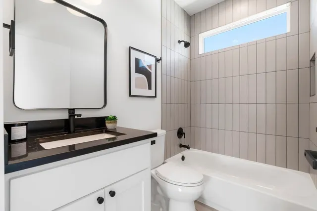 an aerial view of multiple houses with yard