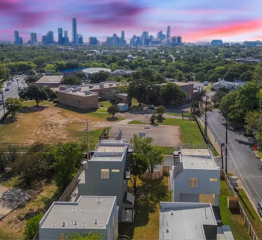 an aerial view of a house with a garden