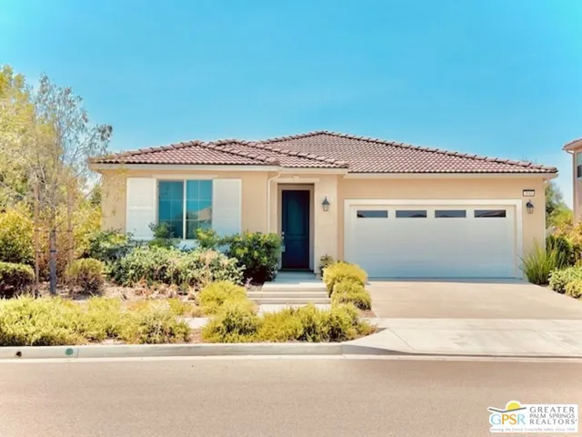 front view of a house with a small yard