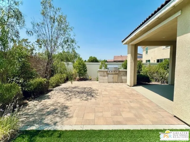 a view of a backyard of the house