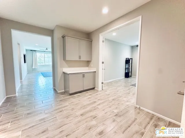 a view of a kitchen cabinets and wooden floor
