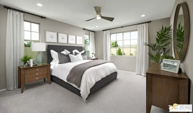 a bed room with a bed and a potted plant