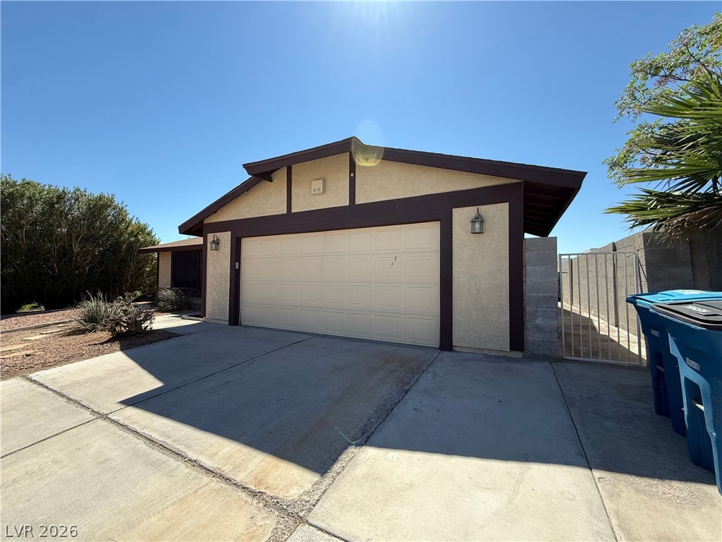 6491 West Viking Road Las Vegas, NV 89103 - Photo 3 of 20 Two car garage, gate access to backyard