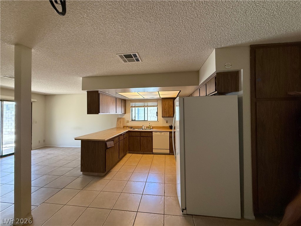 6491 West Viking Road Las Vegas, NV 89103 - Photo 6 of 20 Kitchen with extra storage / pantry on side