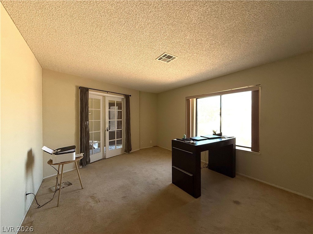 6491 West Viking Road Las Vegas, NV 89103 - Photo 8 of 20 Den / Office with french doors opening to foyer area
