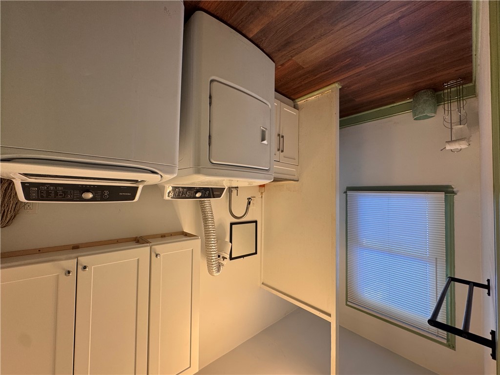 2211 East River Street Anderson, SC 29621 - Photo 10 of 40 This dedicated laundry room provides essential home functionality with practical appliances and storage.
