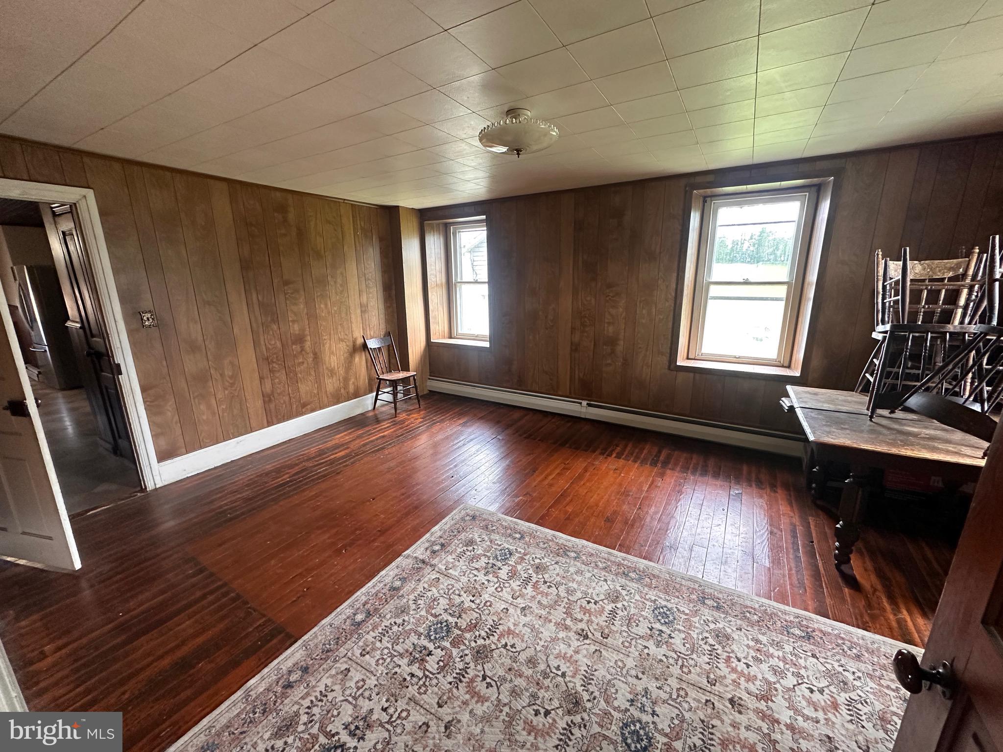92 Deysher Road Fleetwood, PA 19522 - Photo 7 of 12 wooden floor in an empty room with a window