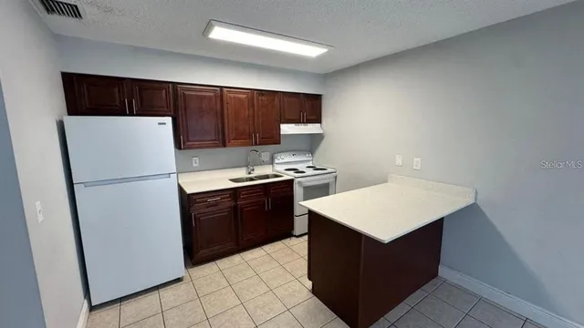 an empty room with wooden floor