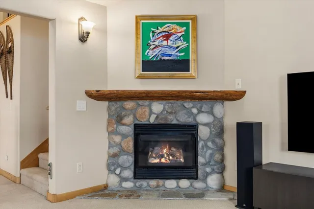 a fireplace with a fireplace in a room