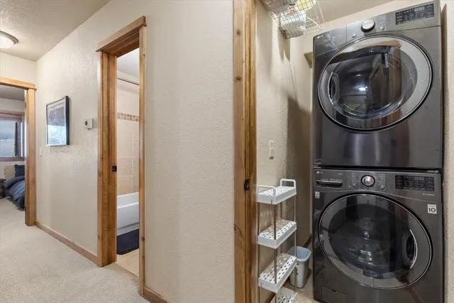 a view of a hallway with washer and dryer