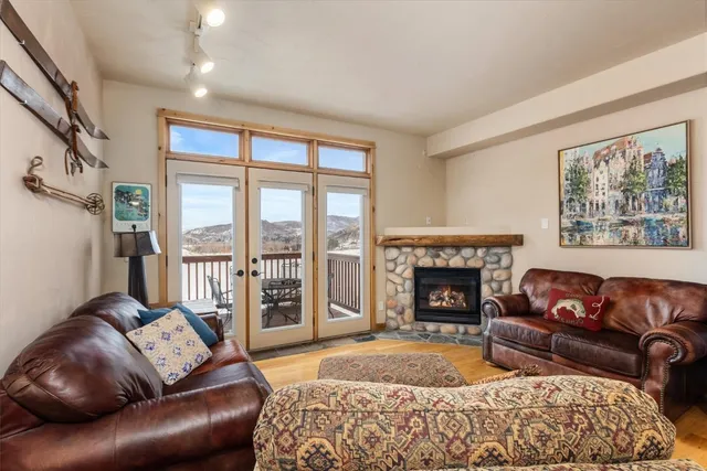 a living room with a couch and a fireplace