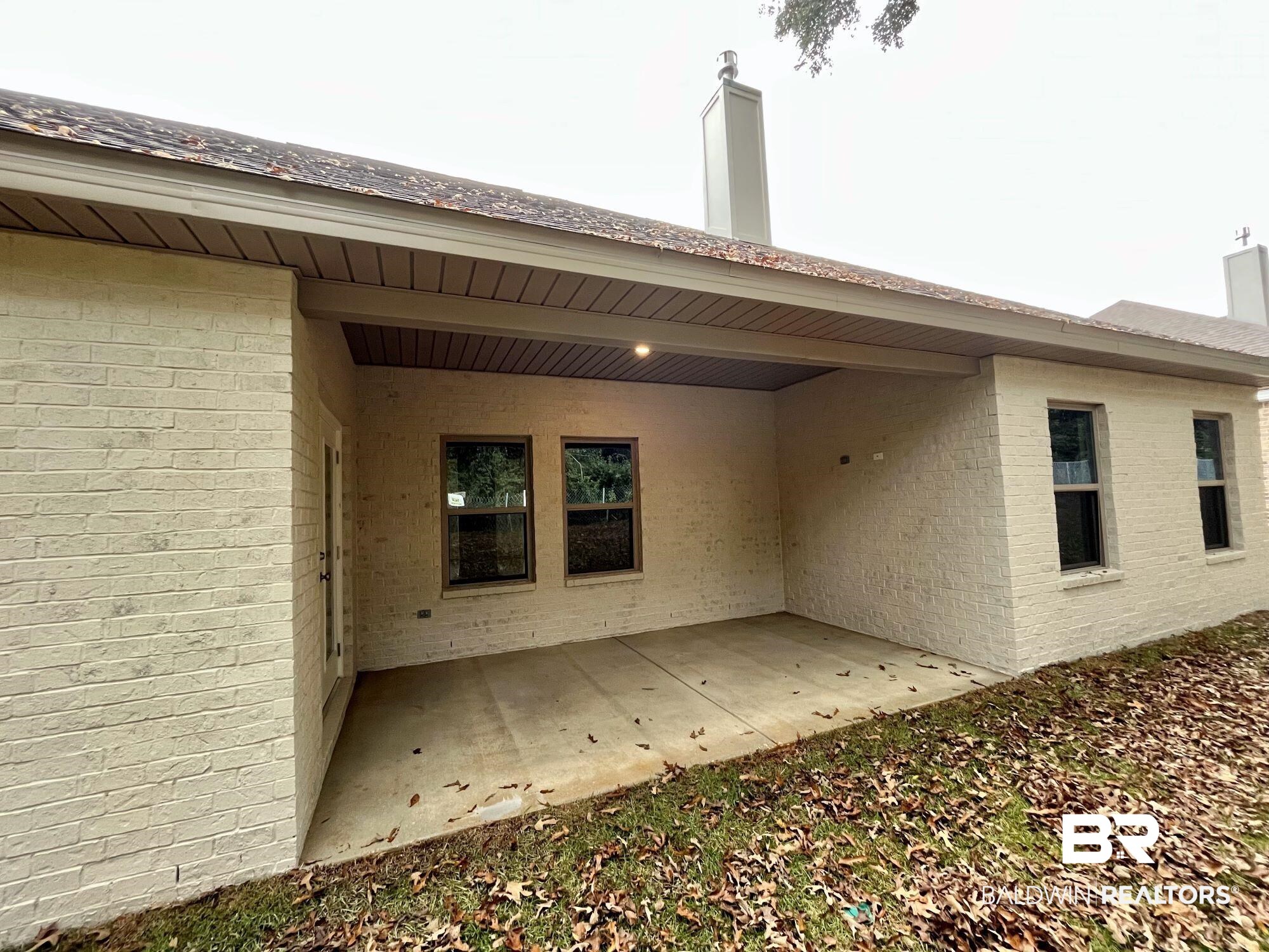 330 Barndling Street Fairhope, AL 36532 - Photo 26 of 31 Rear view of house with a patio
