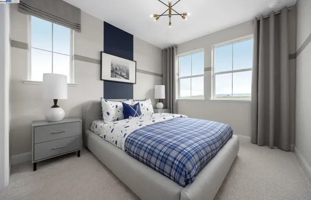 a bedroom with bed and window